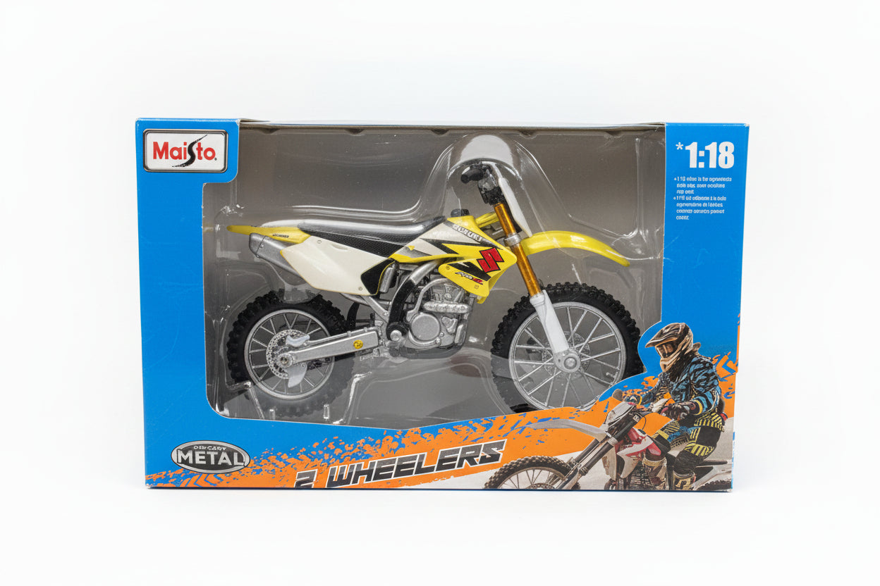 A boxed 1:18 scale metal toy motorcycle called Quincheers by Maisio, featuring a yellow and white dirt bike with black and silver details inside a blue retail package.